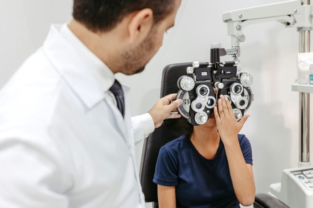 Doctor is checking kids eye.
