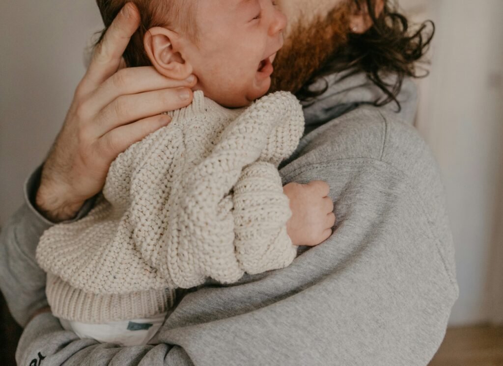 Baby in mother's arm.