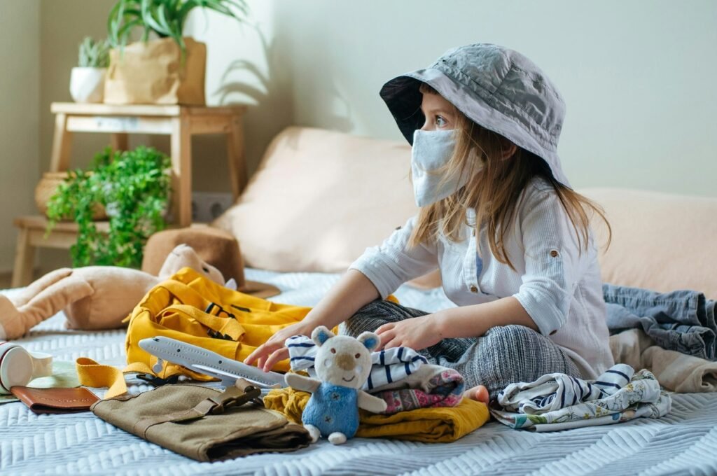 Little girl playing with different toys.