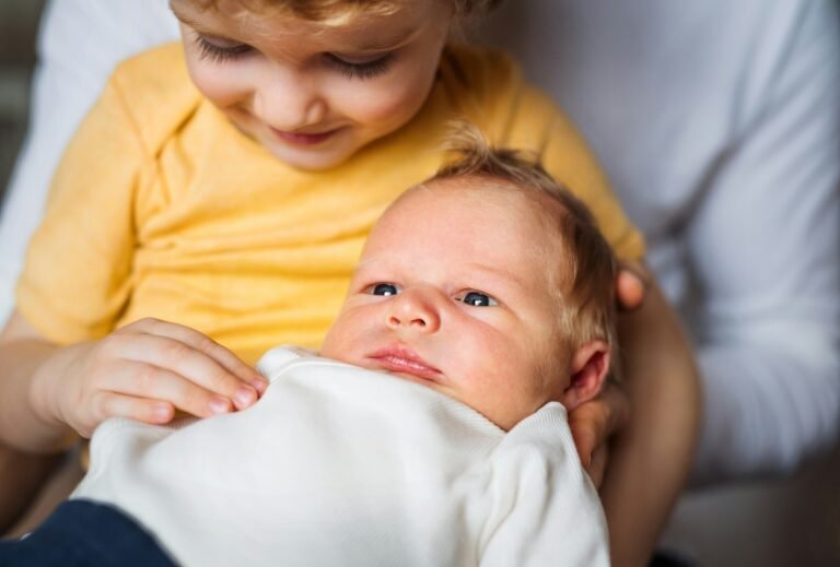 Toddler with newborn.