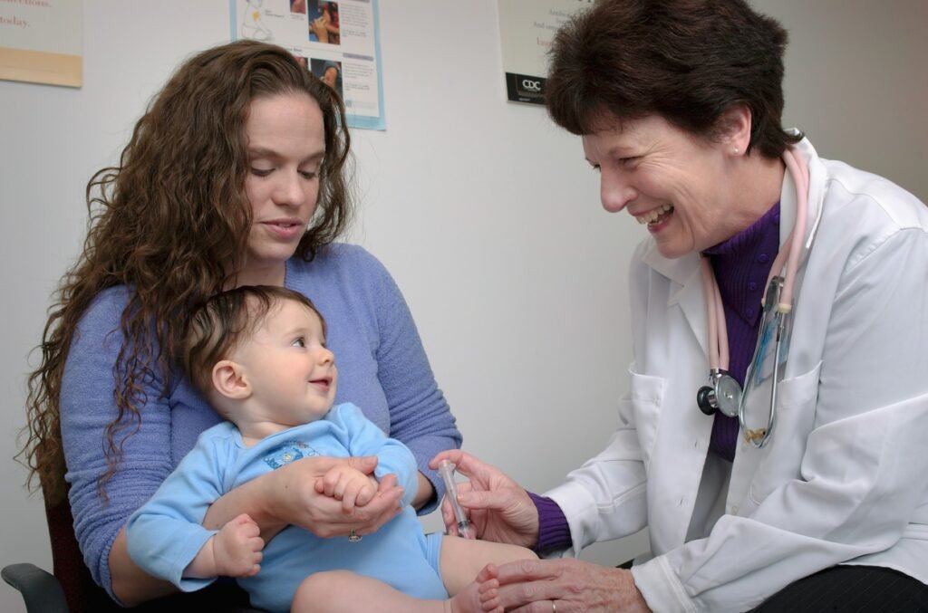 A kid is getting examined by doctor.