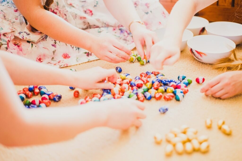 Sharing m&ms with other kids.