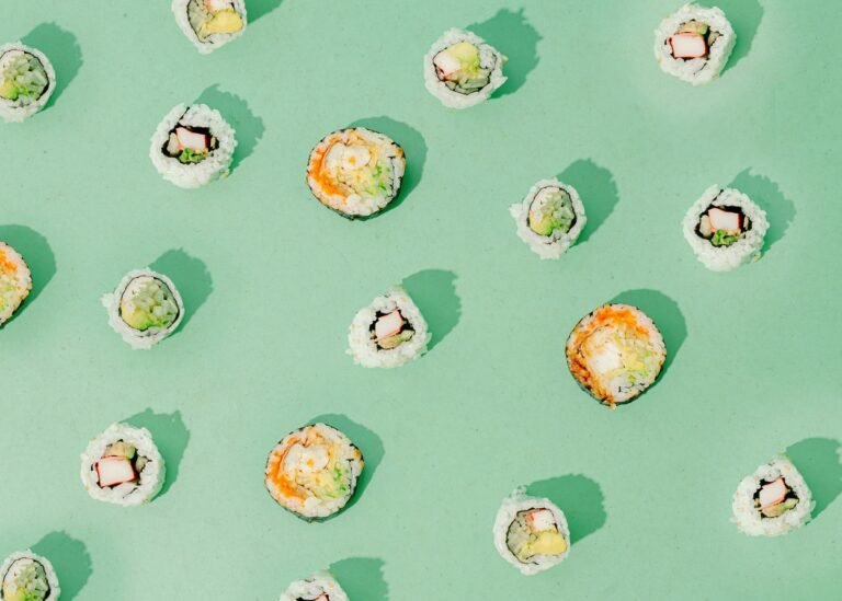Sushi in a light green background.