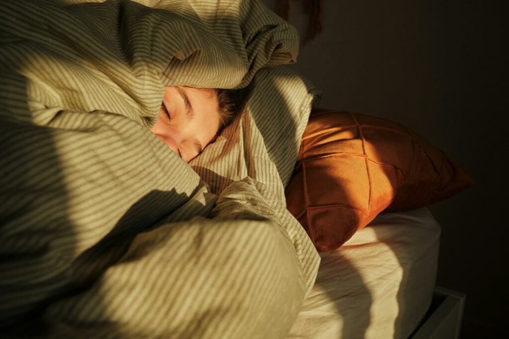 Toddler sleeping with blanket.