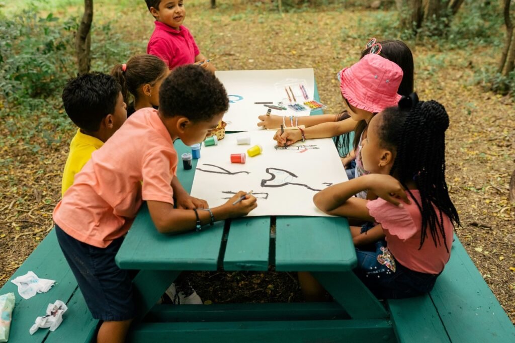 A group of children painting together.