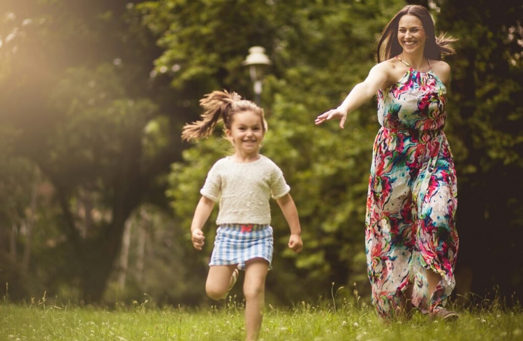 A mother running after her daughter.