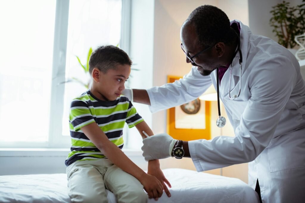 A doctor is checking a kid.