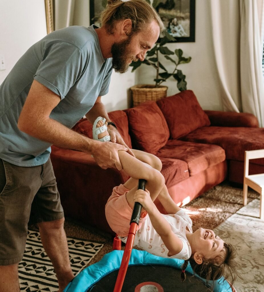 Father helping his daughter having a good time.