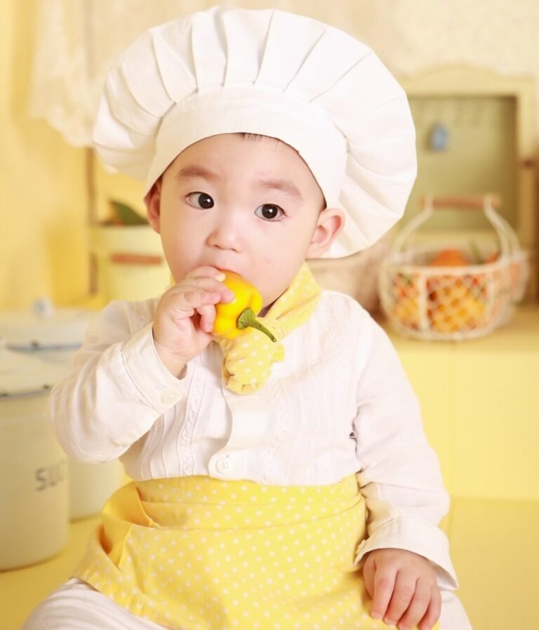 Baby in chef's dress.