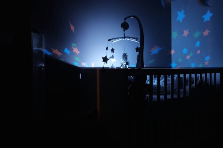 A black wooden crib with LED lights.