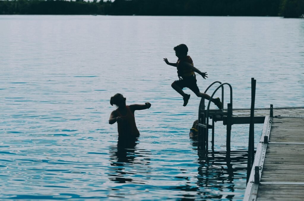 Mother helping son with swimming.