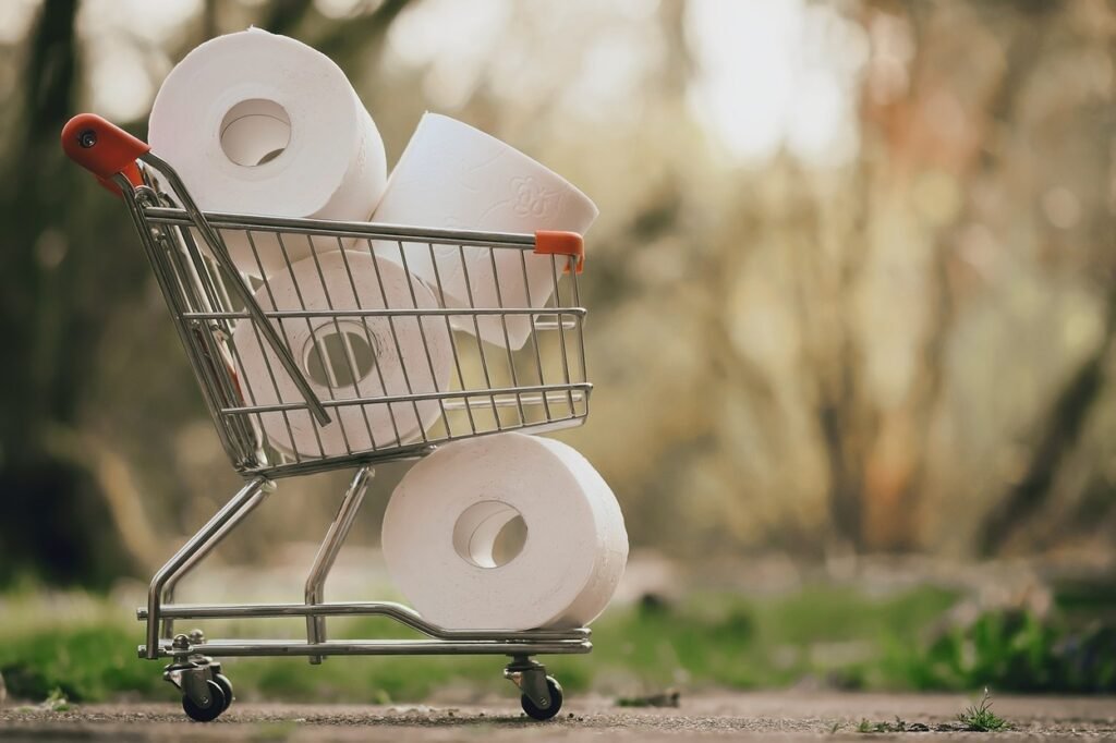 A few tissue rolls in a cart.