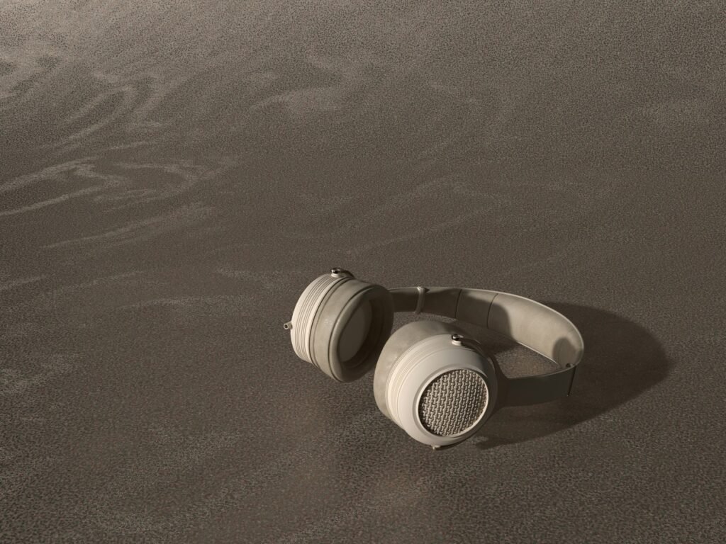 A headphone lying on the beach.