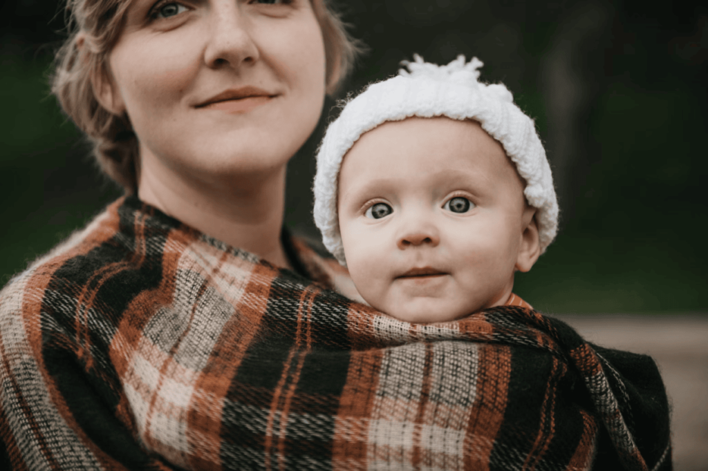 A woman holding her baby in
